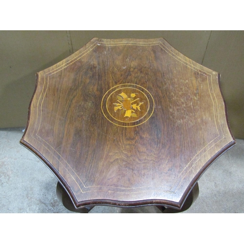 2387 - An inlaid Edwardian rosewood two tier occasional table, the octagonal top with shaped and moulded ou... 