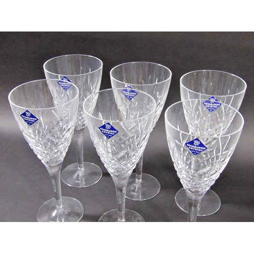 1149 - A boxed set of six large Edinburgh Crystal cut glass wine glasses.