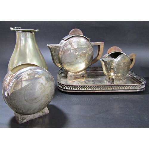 1199 - A mixed selection of silver plated table ware, including an Art Deco three piece tea service, a cant... 