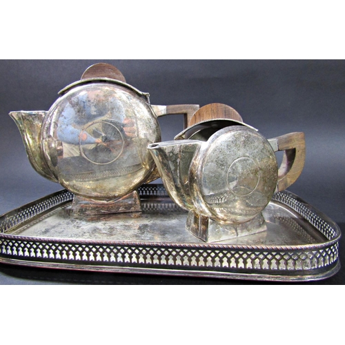 1199 - A mixed selection of silver plated table ware, including an Art Deco three piece tea service, a cant... 