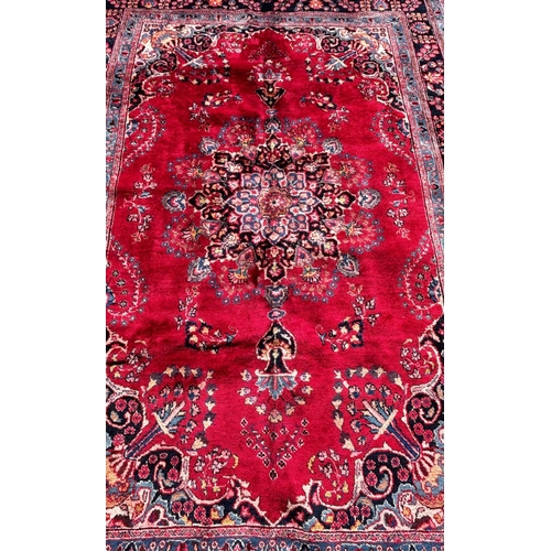 1616 - A North East Persian Meshed Carpet in good condition, with a central floral medallion on a predomina... 