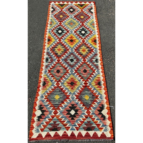 1618 - A Chobi Kilim Runner with a colourful repeating small diamond pattern,197cm 69cm approx.