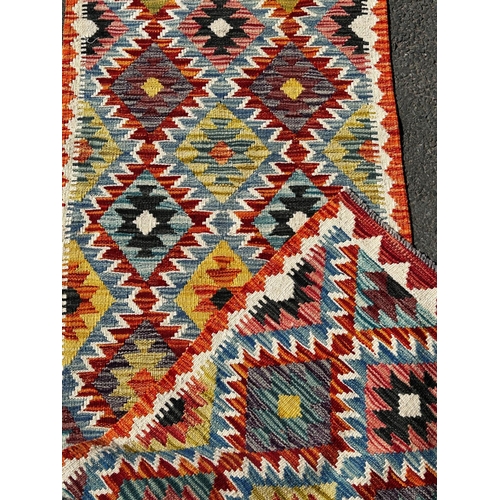 1618 - A Chobi Kilim Runner with a colourful repeating small diamond pattern,197cm 69cm approx.