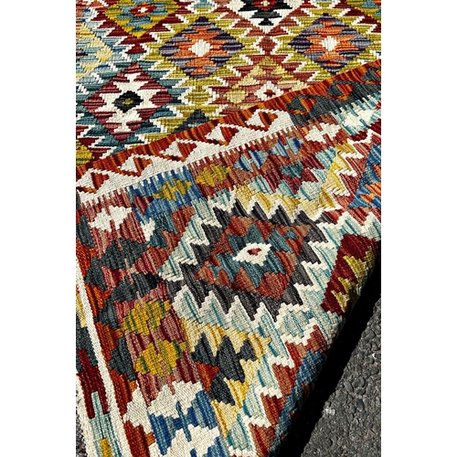 1624 - A Chobi Kilim with an all over repeating geometric pattern, 185cm x 125cm approx.