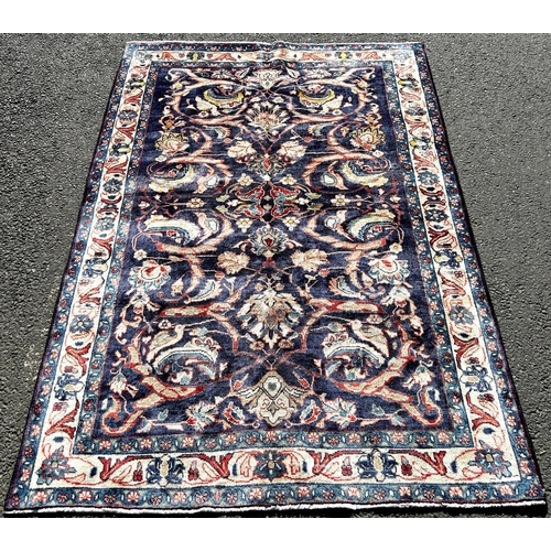 1629 - North West Persian Sarouk rug, with an all over foliate and bird pattern on a blue ground, 200cm x 1... 