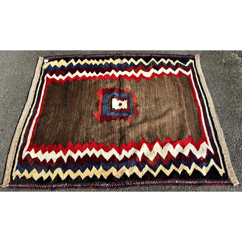 1631 - A North African Kilim eating mat with a zig-zag border , 130cm 130cm, together with a flat weave sad... 