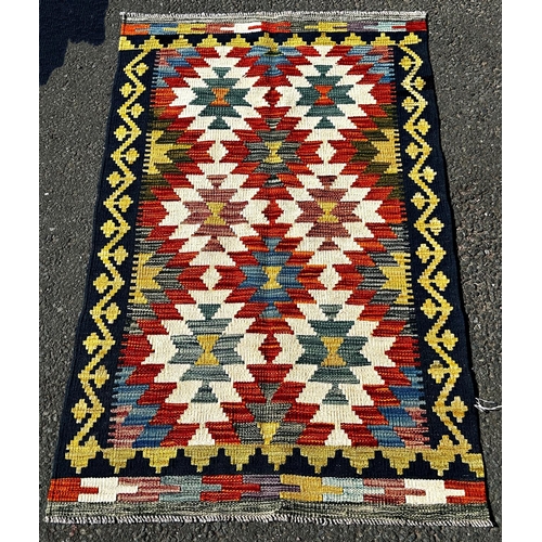 1633 - A Chobi Kilim with a brightly coloured all over geometric pattern, 131cm x 78cm approx