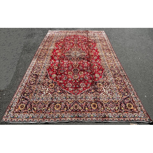 1635 - A good quality Central Persian Kashan Carpet, with a central floral medallion on a red ground with f... 