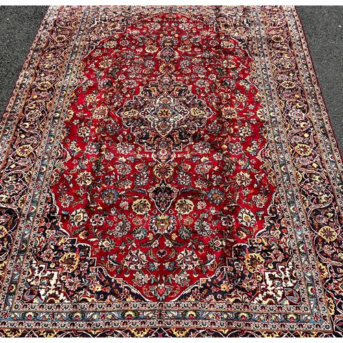 1635 - A good quality Central Persian Kashan Carpet, with a central floral medallion on a red ground with f... 