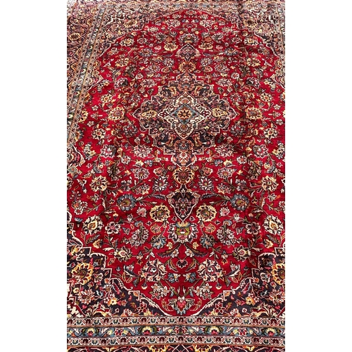 1635 - A good quality Central Persian Kashan Carpet, with a central floral medallion on a red ground with f... 