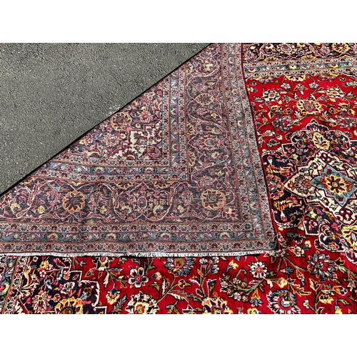 1635 - A good quality Central Persian Kashan Carpet, with a central floral medallion on a red ground with f... 