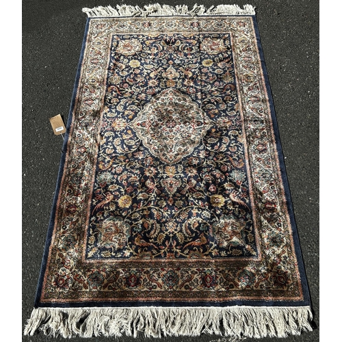 1636 - A Middle Eastern Belgium type machine made carpet, with an all over floral pattern and parrots to th... 