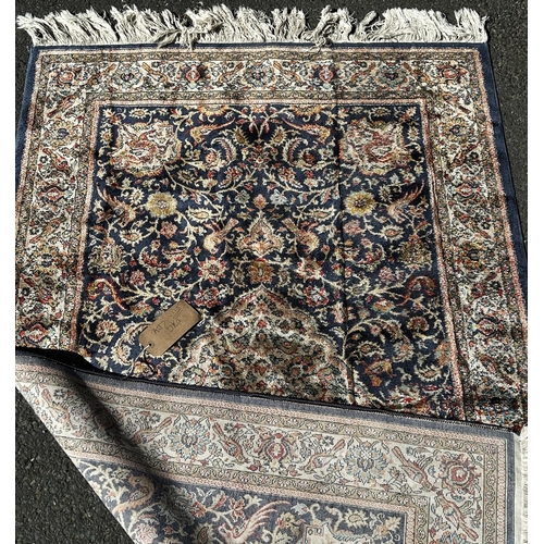 1636 - A Middle Eastern Belgium type machine made carpet, with an all over floral pattern and parrots to th... 