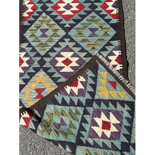 1638 - A Maimana Kilim Runner with a large stepped and diamond pattern on a blue ground 212cm x 70cm approx... 