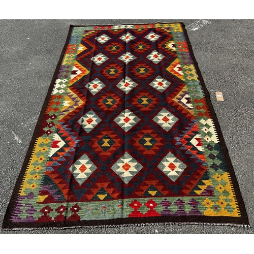 1641 - A Maimana Kilim with a repeating colourful over all geometric pattern, 258cm 153cm approx.