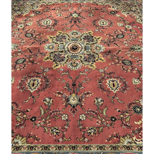 1642 - A large Middle Eastern machine made seamless Wilton all wool W G & Co Kidderminster carpet with a fl... 