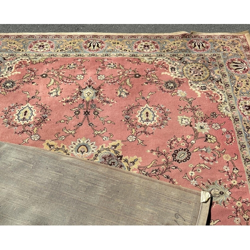 1642 - A large Middle Eastern machine made seamless Wilton all wool W G & Co Kidderminster carpet with a fl... 