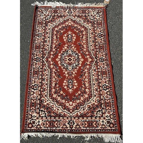 1649 - A faded old Kazak carpet an elongated lozenge central medallion, 195cm x 96cm approx and a small mac... 