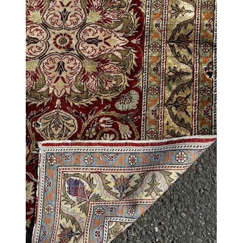 1650 - A small silk mat with a floral pattern (as found small holes) 118cm x 74cm, and another silk Persian... 