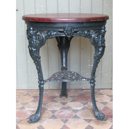 2075 - A good quality refurbished heavy cast iron circular Britannia head pub table with pierced scrolling ... 