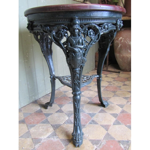 2075 - A good quality refurbished heavy cast iron circular Britannia head pub table with pierced scrolling ... 