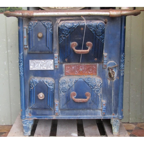 2076 - A French art deco cast iron and a blue enamelled stove with foliate detail (af for restoration) 83cm... 