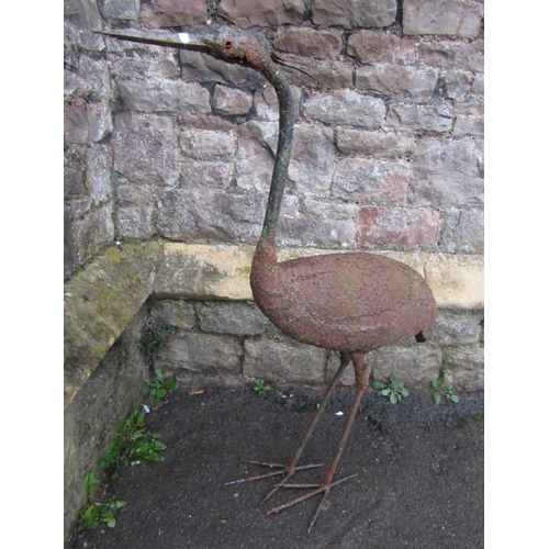 2081 - A weathered light steel garden ornament in the form of a standing crane, 93cm high