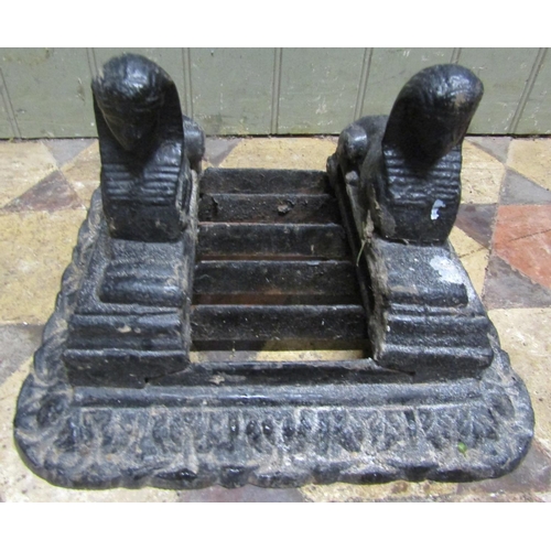 2082 - 19th century cast iron boot scraper with pseudo Egyptian mounts, 20cm high x 33cm square approx