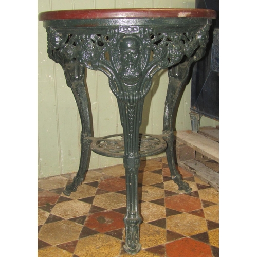 2083 - A good quality refurbished cast iron WG Grace mask pub table, with decorative pierced fruiting vine,... 