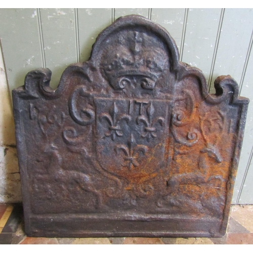 2085 - A heavy cast iron fireback with stag, shield and crown detail, 68cm wide x 69cm high (af cracked)