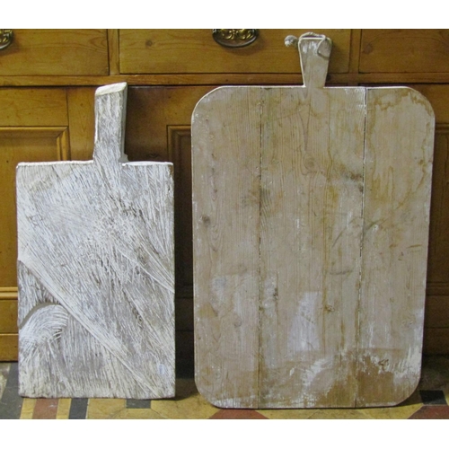 2089 - Two rustic pine outsized breadboards with a paint washed finish, the largest 80cm x 50cm