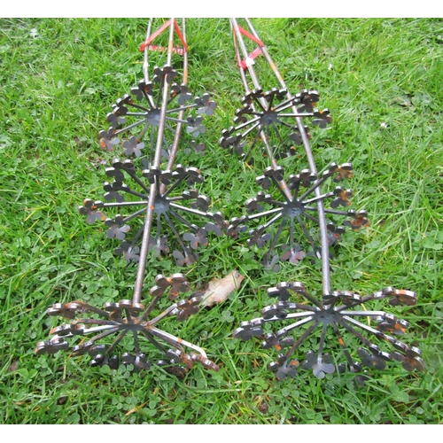 2092 - A pair of ornamental three stemmed heavy gauge steel border stakes, 180cm high