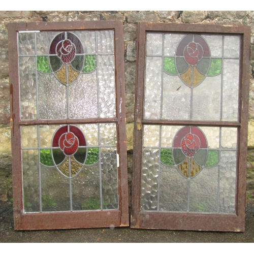 2093 - A pair of Edwardian stained wooden framed cupboard doors, enclosing stained glass panels, each door ... 