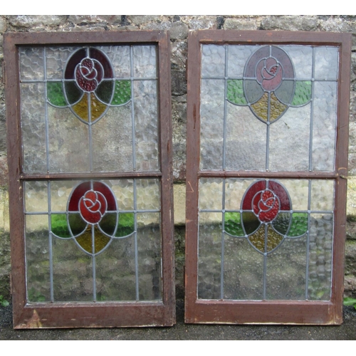 2093 - A pair of Edwardian stained wooden framed cupboard doors, enclosing stained glass panels, each door ... 