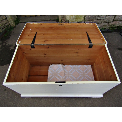 2350 - A large 19th century pine blanket box with hinged lid, side carrying handles and layers of over pain... 