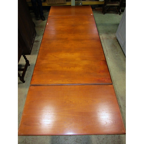 2354 - A retro G plan teak rectangular dining table with two additional end leaves raised on simple turned ... 