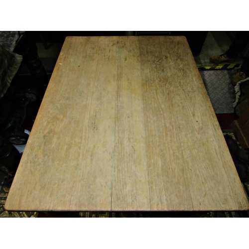 2363 - A vintage pine scrub top kitchen table of rectangular form fitted with an end frieze drawer raised o... 