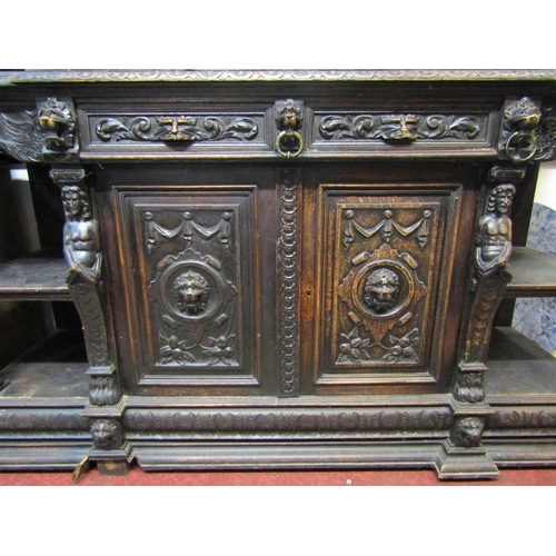 2385 - A substantial Victorian gothic oak mirror backed sideboard with green man, lions mask, scrolling aca... 