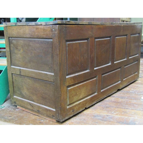 2569 - 18th century panelled oak coffer with simple plank lid, 140cm