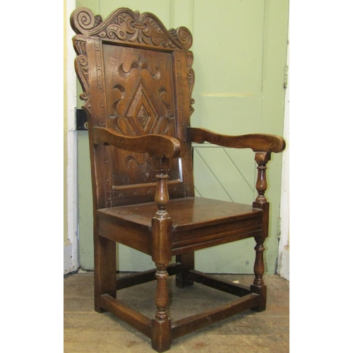 2570 - An old English oak Wainscot chair of usual form with carved and panelled framework