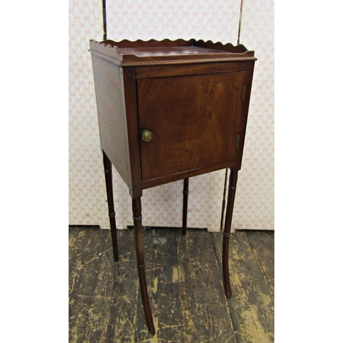 2572 - A Georgian mahogany pot cupboard with three quarter gallery raised on turned supports with swept out... 