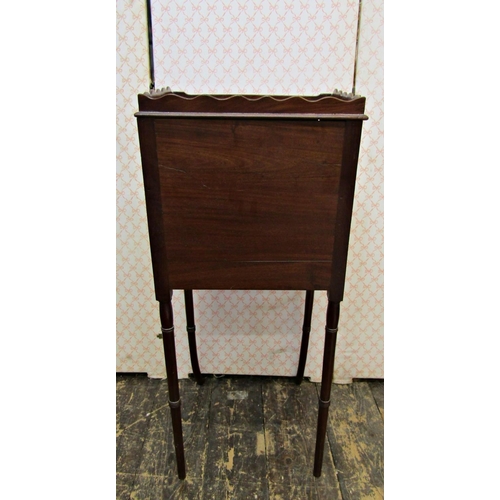 2572 - A Georgian mahogany pot cupboard with three quarter gallery raised on turned supports with swept out... 