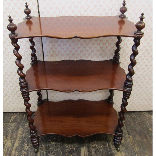 2591 - A Victorian mahogany three tier watnot, with shaped shelves and barley twist supports, 90cm high x 6... 