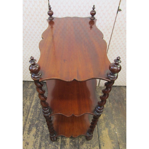 2591 - A Victorian mahogany three tier watnot, with shaped shelves and barley twist supports, 90cm high x 6... 