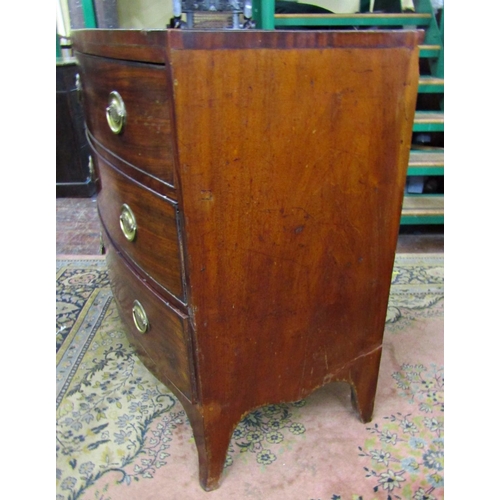 2597 - A Regency mahogany bowfronted chest of three long drawers with caddy top, raised on swept supports w... 