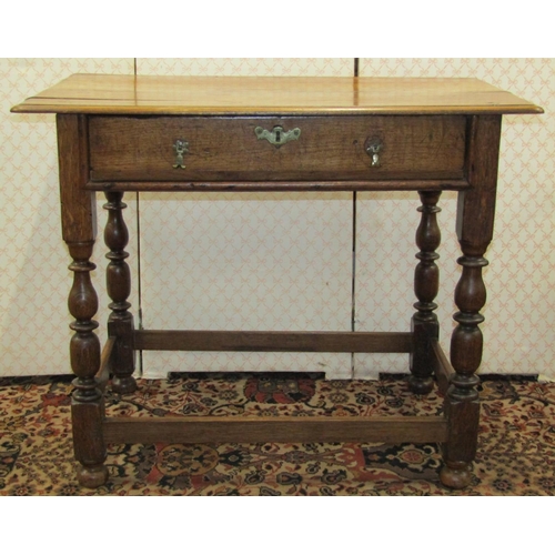 2598 - A Georgian oak country made side table with frieze drawer, on four turned supports, 90cm wide