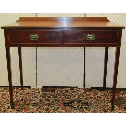 2601 - A late Georgian mahogany side table fitted with two frieze drawers raised on square taper legs with ... 