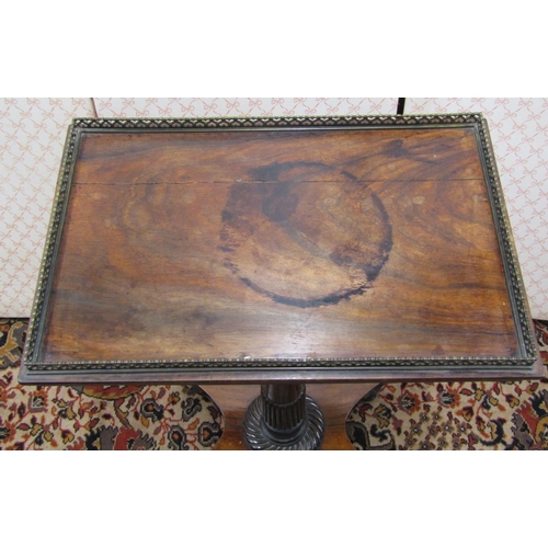 2605 - A Regency rosewood occasional table, the rectangular top set within a pierced brass framework, raise... 