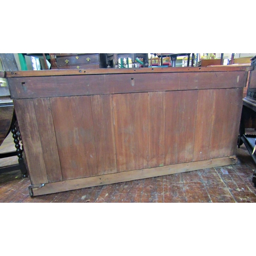 2607 - A Victorian mahogany inverted breakfront four door sideboard with applied and carved detail, with th... 