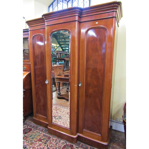 2616 - A Victorian mahogany bedroom suite comprising a small breakfront three door wardrobe with mirror pan... 